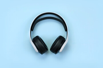 Headphones for playing a computer console on a blue background, layout