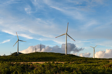 Wind energy background, wind turbines at sunset