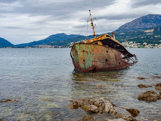 Old rusty ship near the shore of the Mediterranean in Montenegro