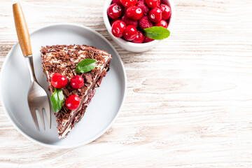 Delicious chocolate sponge cake with cherry. Top view. Copy space