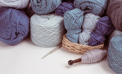 Craft hobby with Vintage knitting needles, yarn ball on white background, still life photo with soft focus. View from above. Handicraft day concept. space text. Crochet background blue Pastel theme.