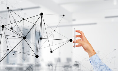 Business and technology concept with networking grid and man using device