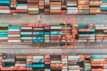 Aerial view of shipping container port terminal. Colourful pattern of containers in harbor....