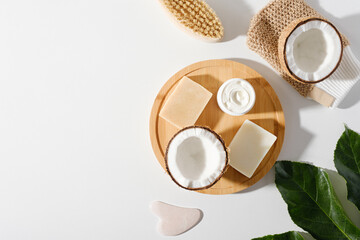 eco organic cosmetic on white background, natural handmade soap, body brush, cream with coconut,...