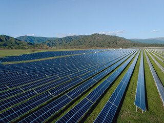 Technological innovations. A large number of solar panels standing in the mountains. Taking care of the environment.