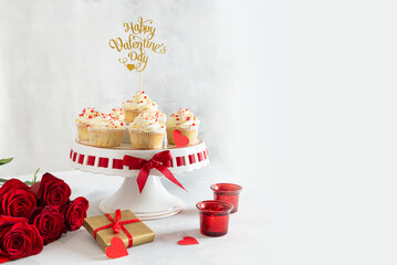 St. Valentine's Day dessert recipe. Cupcakes with small hearts on light background. Romantic dinner, bakery banner. Greeting card design. Happy Valentines Day. Copy space