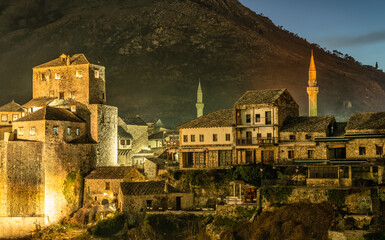 view of Mostar old town with bridge tower and mosque minarets.