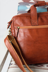 close-up photo of red leather bag corporate.