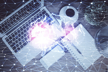 Double exposure of brain drawing hologram over topview work table background with computer. Concept...