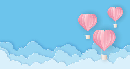 Valentine's Day card in paper cut style. Pink beautiful hot air balloons flying in the sky.