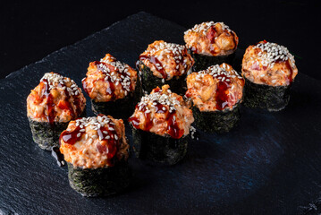 Set fresh delicious Japanese sushi on dark background