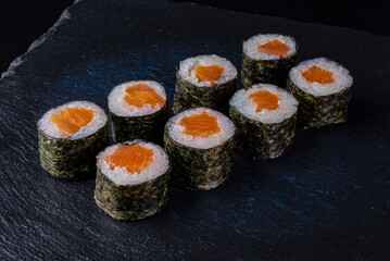 Set fresh delicious Japanese sushi on dark background