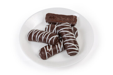 Cookies glazed with dark and white chocolate on dish