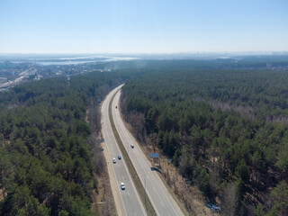 Section of highway with forest on both sides, aerial view