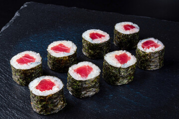 Set fresh delicious Japanese sushi on dark background