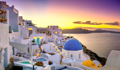 Picturesque sunrise on famous view resort over Oia town on Santorini island, Greece, Europe. famous travel landscape. Summer holidays. Travel concept background.