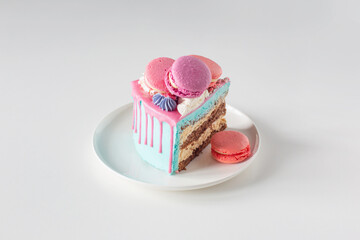 piece of cake with pink and blue decor on white plate