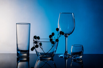 glass goblets on a blue background, a composition of goblets