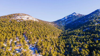 Fototapeta na wymiar Aerial drone view of the Sierra de Guadarrama in Madrid with snow