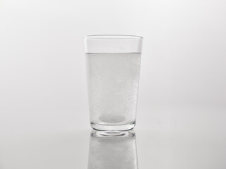 a medicine dissolved in a glass of water