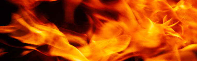 Abstract image of fire flames on dark background. Horizontal image.