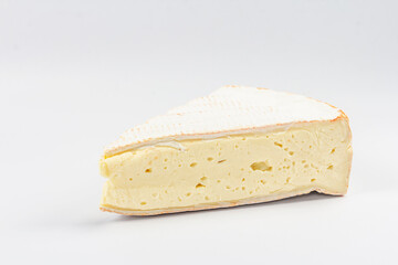 Rougette cheese isolated on white background. Soft-ripened red rind cheese