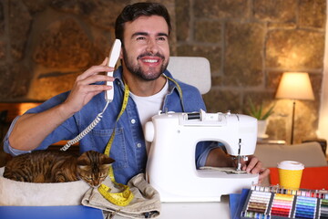 Male fashion designer making a phone call 