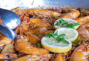King prawns cooked in an iron skillet