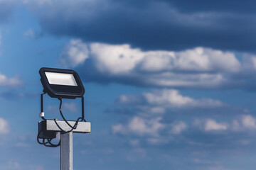 Close-up of street led spotlight on iron pole against sky