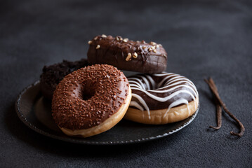 Chocolate donuts and vanilla, sweet delicious baked dessert - obrazy, fototapety, plakaty