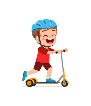 cute little boy riding scooter and wear helmet