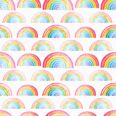Watercolor seamless pattern with colored watercolor rainbows.