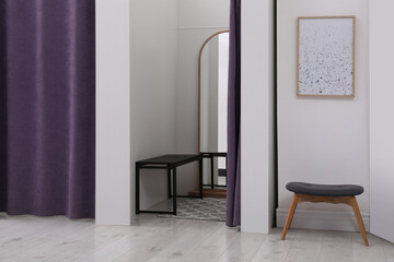 Empty dressing room in fashion store. Stylish interior