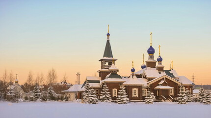 Fototapeta na wymiar Evening winter landscape with a beautiful Russian wooden church