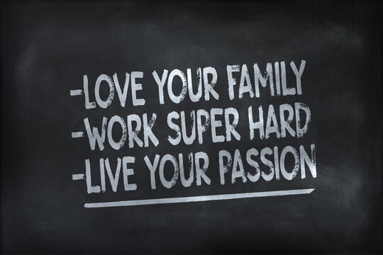 love your family, work super hard,live your passion. motivational quote written on white chalk