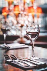Table setting in restaurant with glass