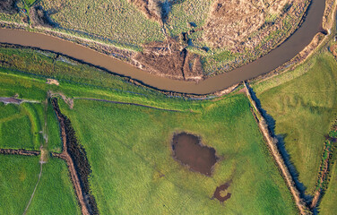 Top Down view from a drone over Meadows and Marshland around Clyst River in Topsham, Devon, England