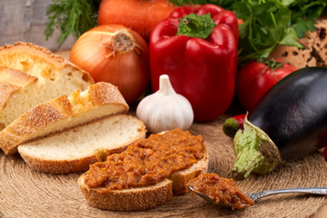 Obraz na płótnie Canvas Sandwich with squash caviar, table setting with vegetables