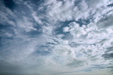 blue cloudy sky on a sunny day background screensaver backdrop