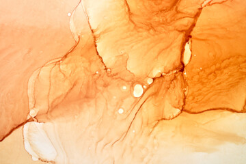 Abstract ocher ink watercolor background. Yellow orange brown paint stains and spots in water,...