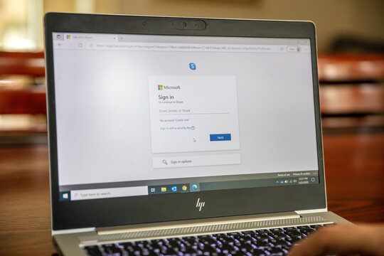 Skype Microsoft communication app logo on laptop computer screen.