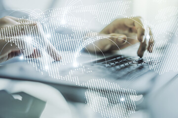 Double exposure of abstract digital world map with connections and hands typing on laptop on background, research and strategy concept