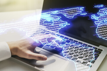 Double exposure of digital America map and hands typing on laptop on background, research and strategy concept