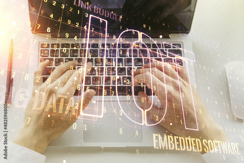 Aufkleber creative iot hologram with hands typing on computer keyboard on background, internet of things conce