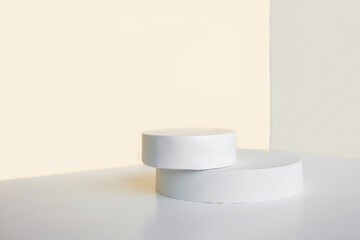 Podium for cosmetic product presentation. Abstract minimal geometrical form. Cylinder podium sphere, two forms, soft shadow. Scene to show products. Showcase, display case. Flat lay, side view