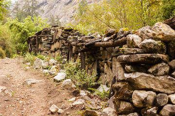 Prayer stone wall on the road in the Himalayas