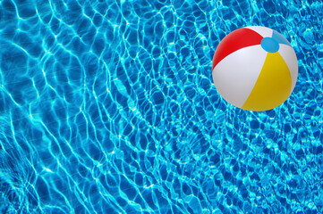 Swimming pool water and beach ball