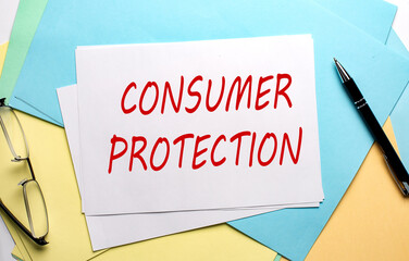 CONSUMER PROTECTION text on paper on the colorful paper background