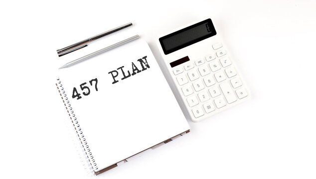 Notepad with text 457 PLAN with calculator and pen. White background. Business concept