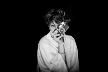 Woman Taking A Photo With An Old Camera. 40-Year-Old Woman Posing For International Women's Day, March 8. Warrior Woman.